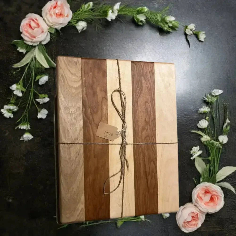 Handmade cutting board made from cherry and hard maple, eco-friendly design with elegant aesthetics, 10" x 13" size.