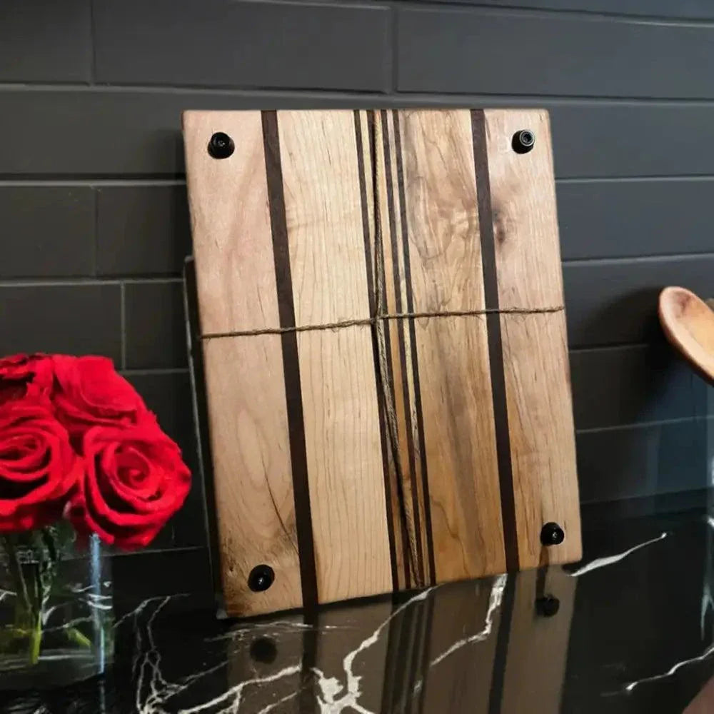 Artisan made kitchen cutting board with hard maple and black walnut accents, featuring non-slip foot pegs.
