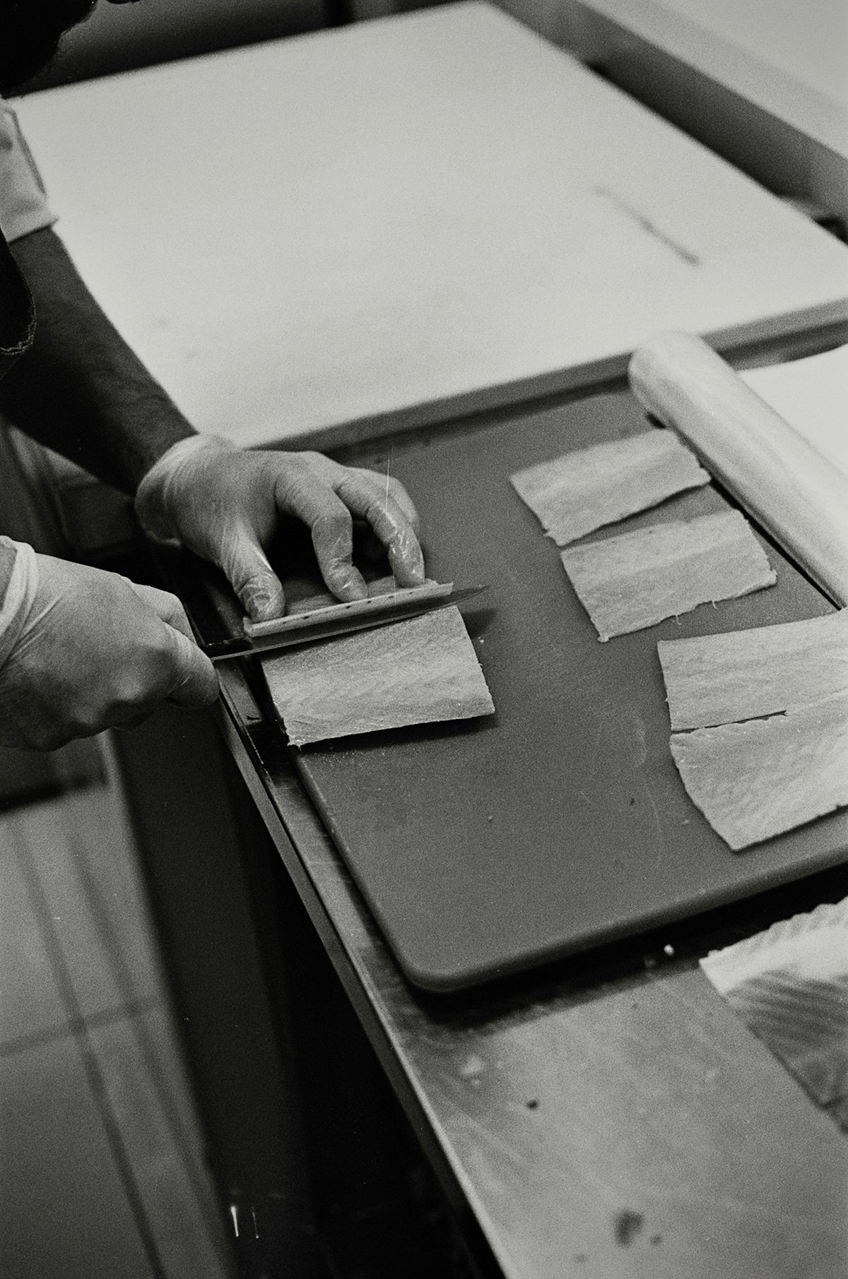 grayscale photo of person holding ipad