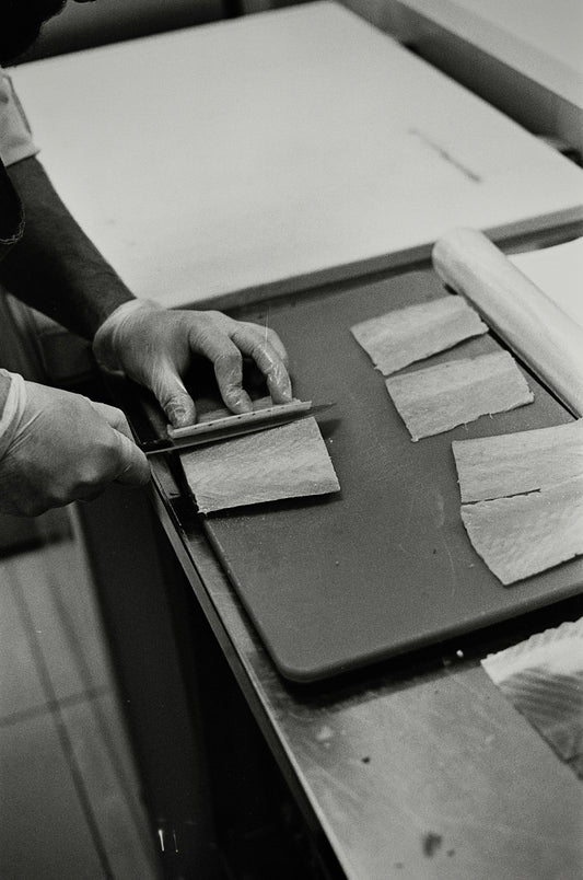 grayscale photo of person holding ipad