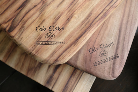 a couple of wooden boards sitting on top of a table