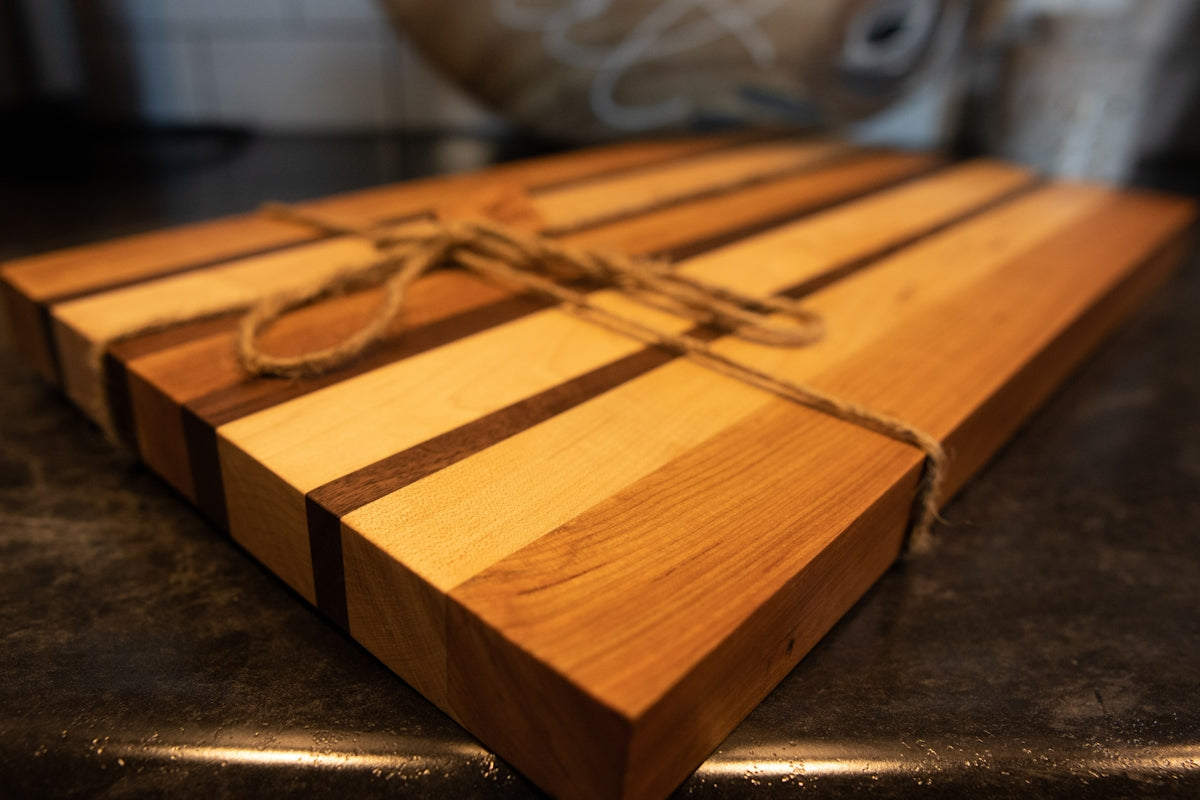 a wooden box with a metal handle