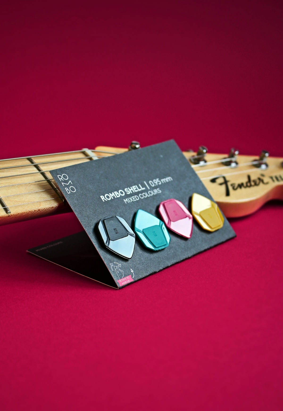 a pair of guitar picks sitting on top of a guitar