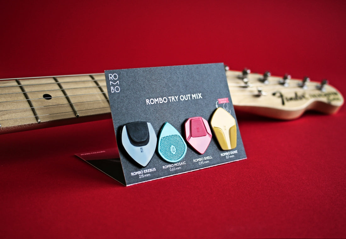 a business card with a guitar and a guitar neck