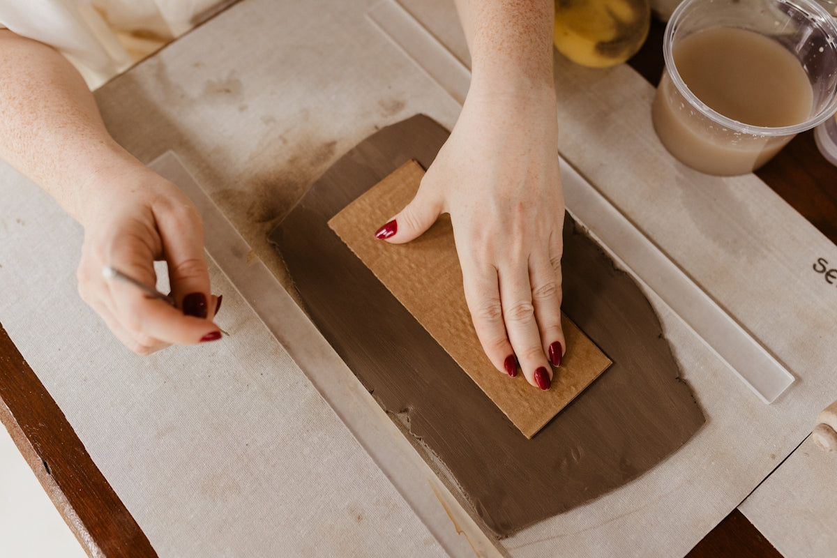 A woman is working on a craft project