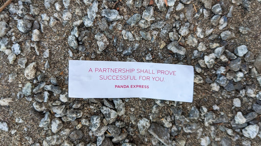 A piece of paper that is laying on the ground