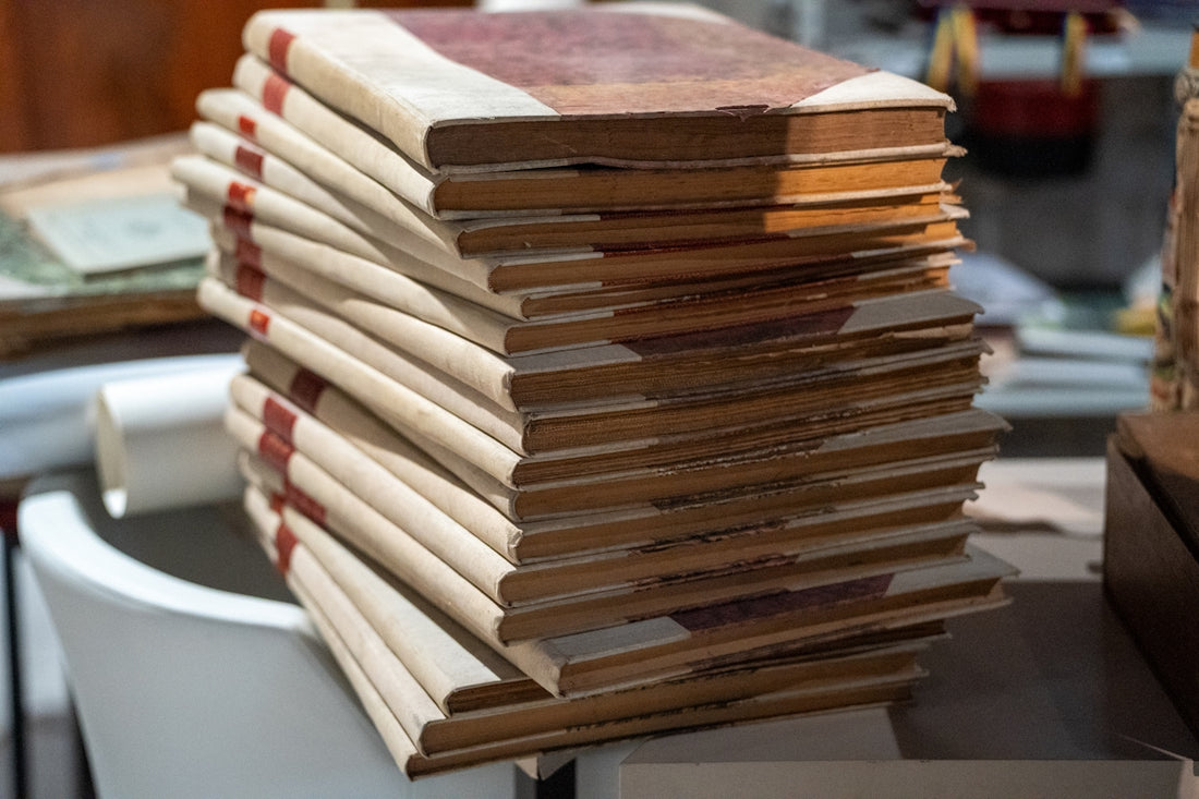 A stack of books sitting on top of a table