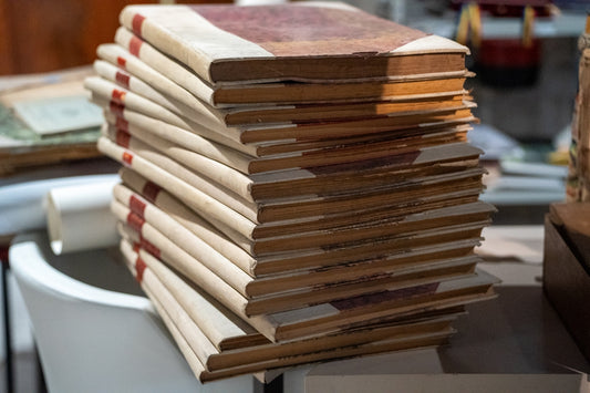 A stack of books sitting on top of a table