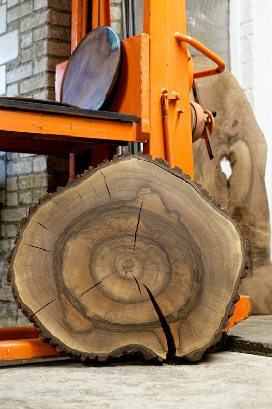 A forklift with a large piece of wood on top of it