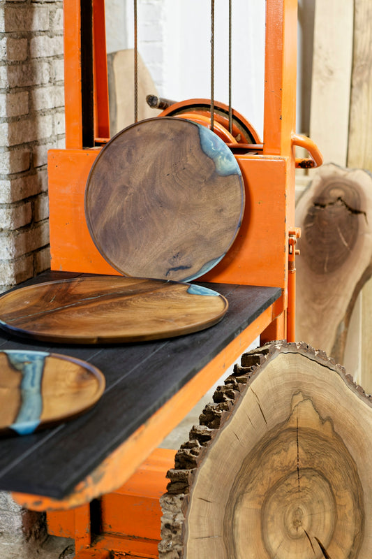 A couple of wooden plates sitting on top of a table