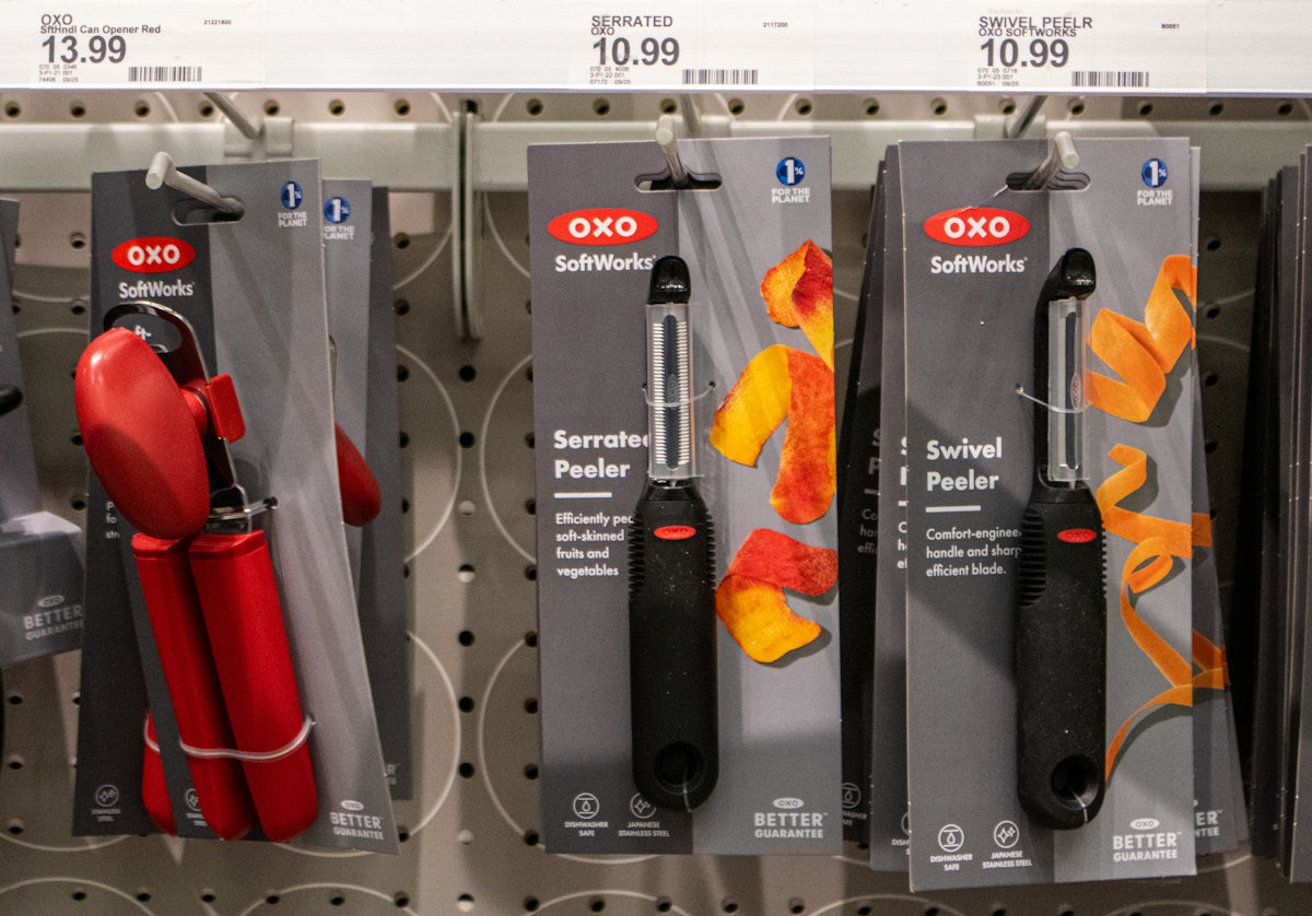 Kitchen tools are displayed on a store shelf.