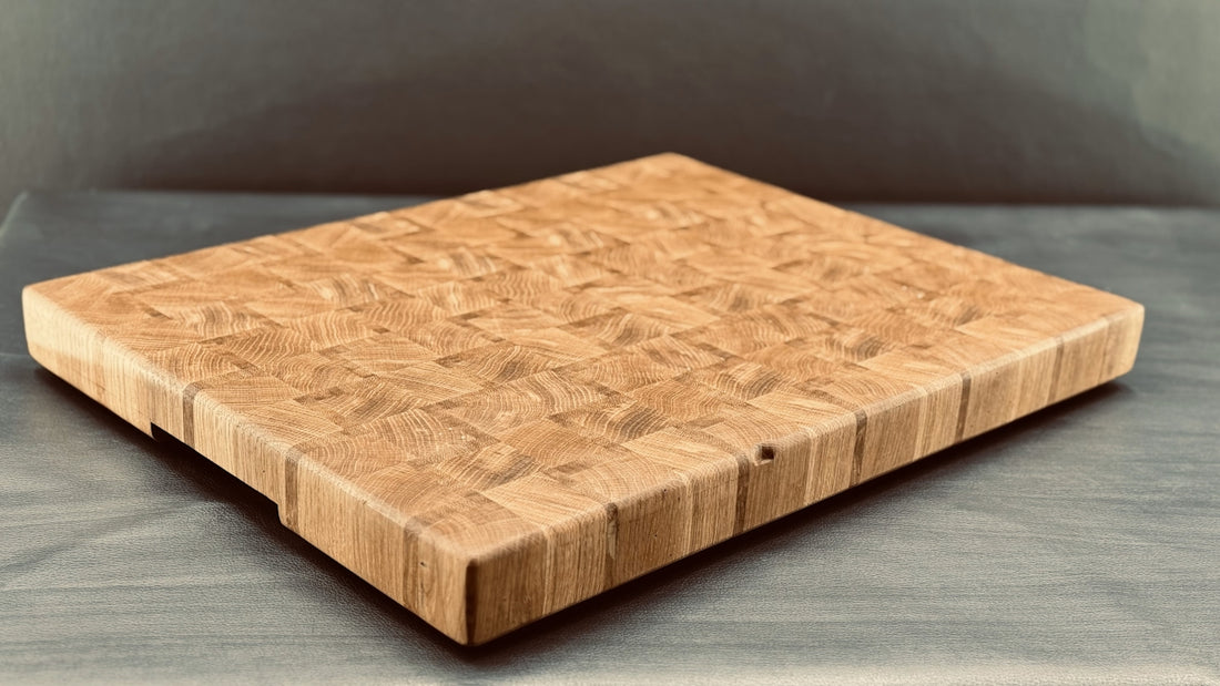 A wooden end-grain cutting board sits still.
