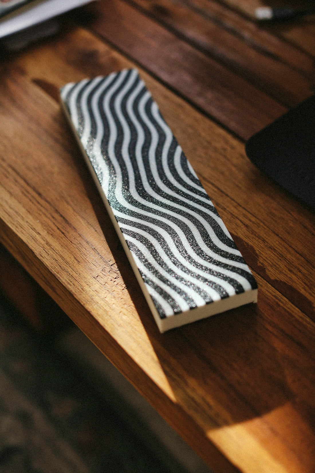 A black and white wavy-patterned object.