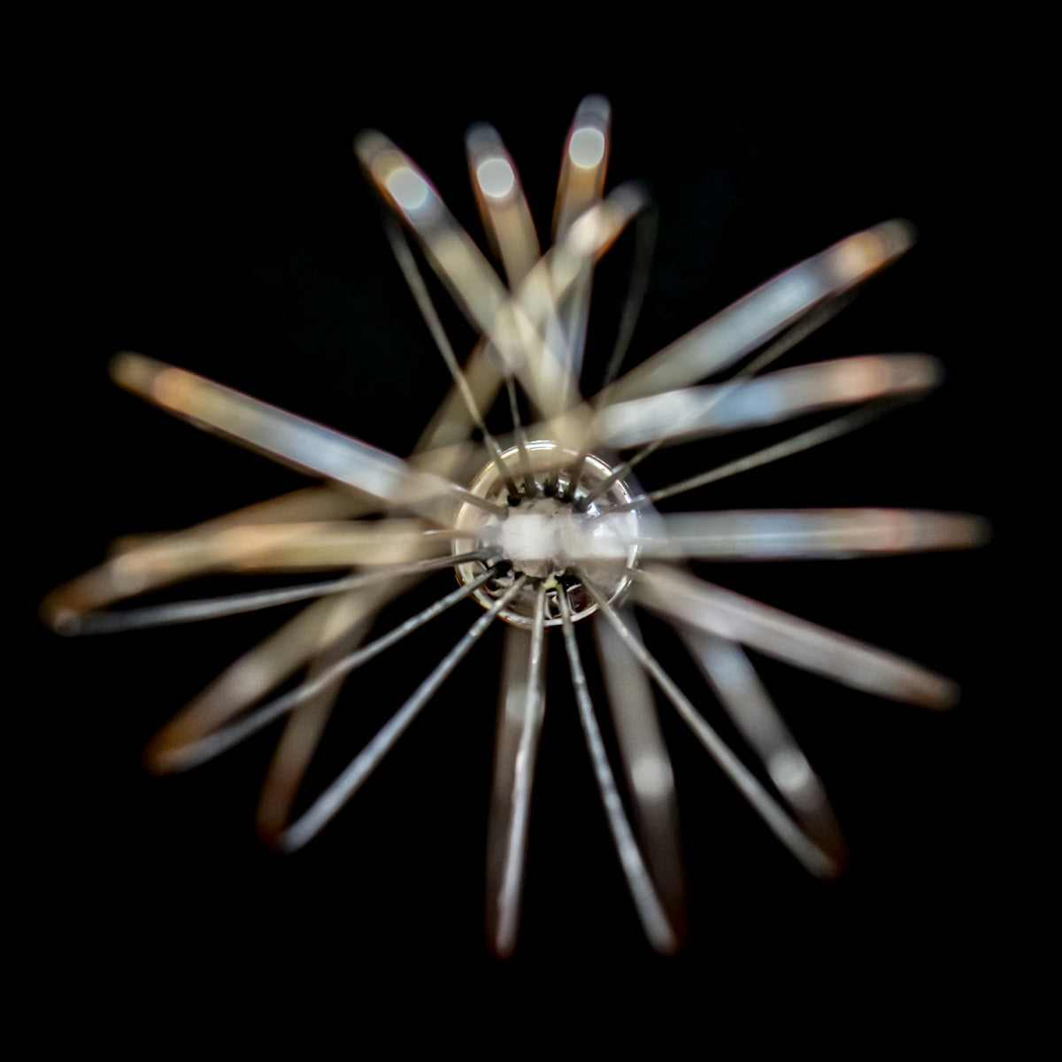 Abstract starburst pattern with blurred lights on black