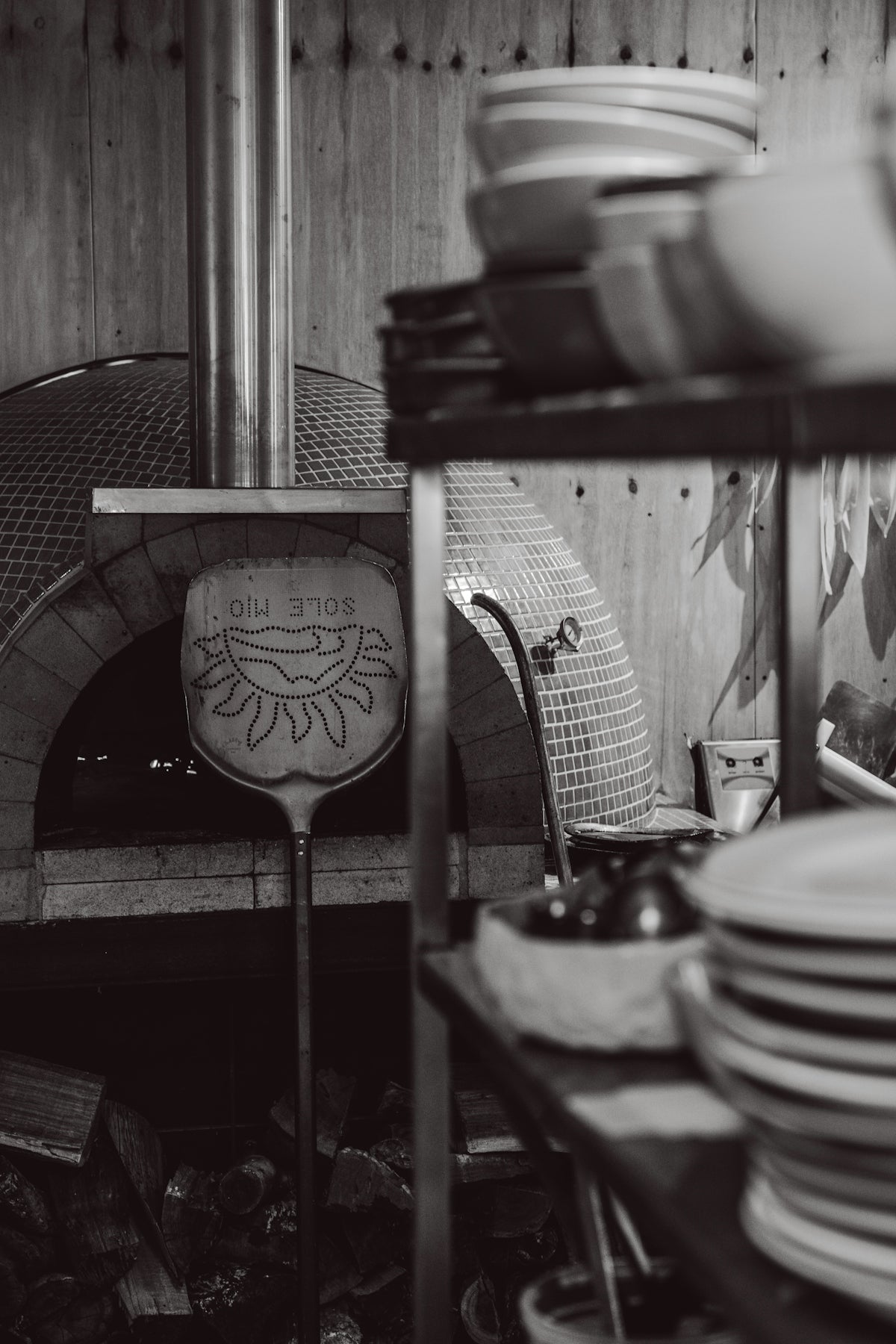 Pizza oven with peel and stacked plates