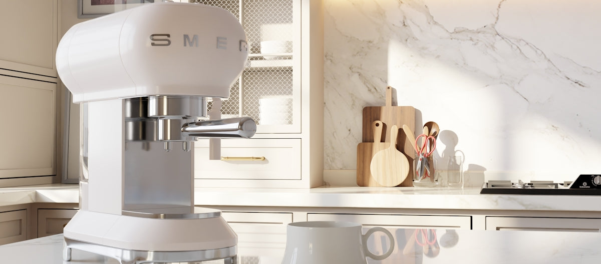 White espresso machine on a kitchen counter.