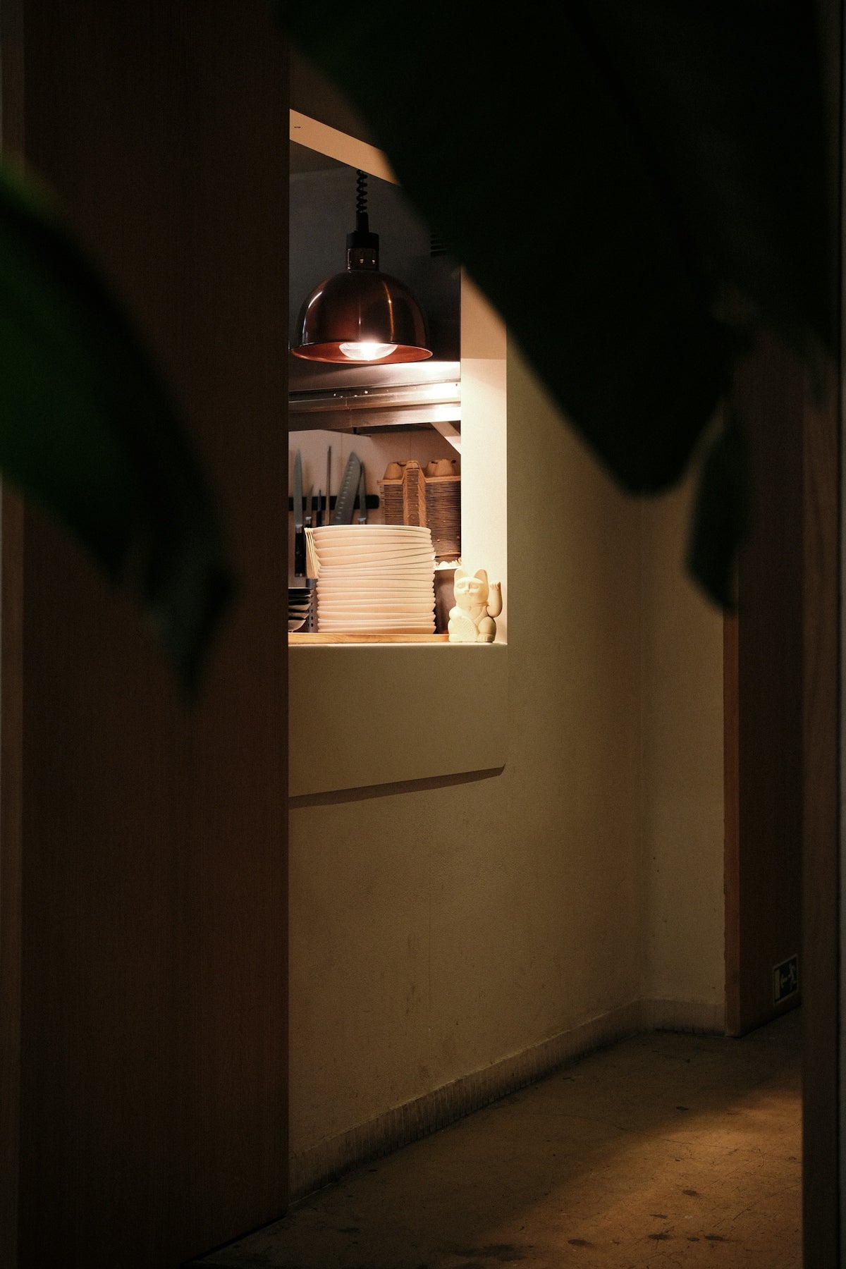 Warmly lit interior with a hanging lamp