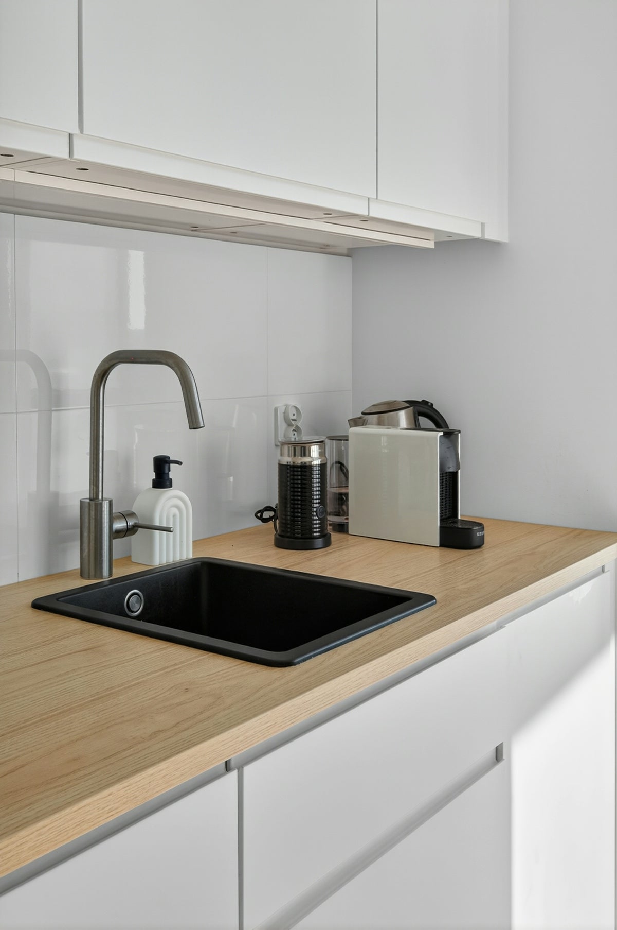 Modern kitchen counter with sink and coffee machine