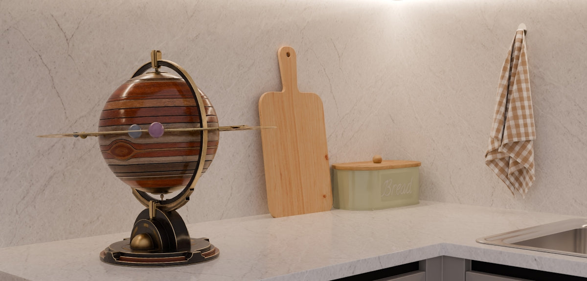 Kitchen counter with decorative globe, cutting board, and hanging towel.