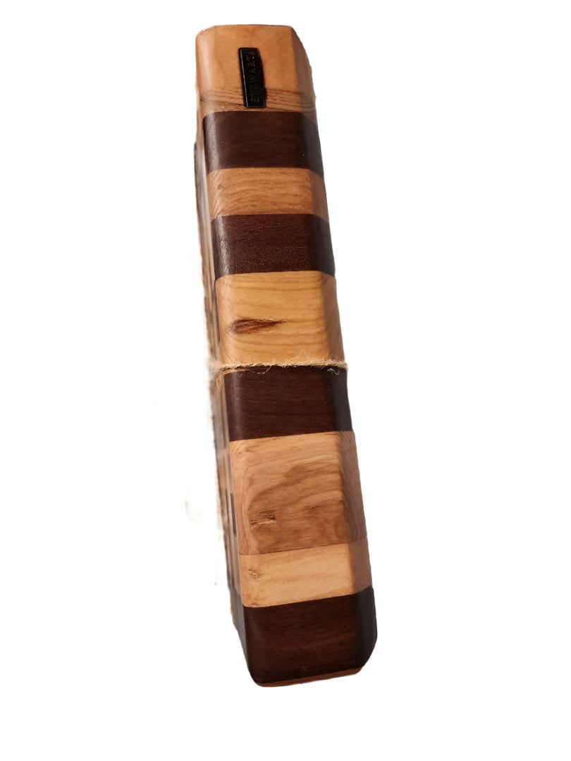 Handcrafted mini end grain chopping board made from black walnut, cherry, and maple wood with intricate pattern, tied with twine.