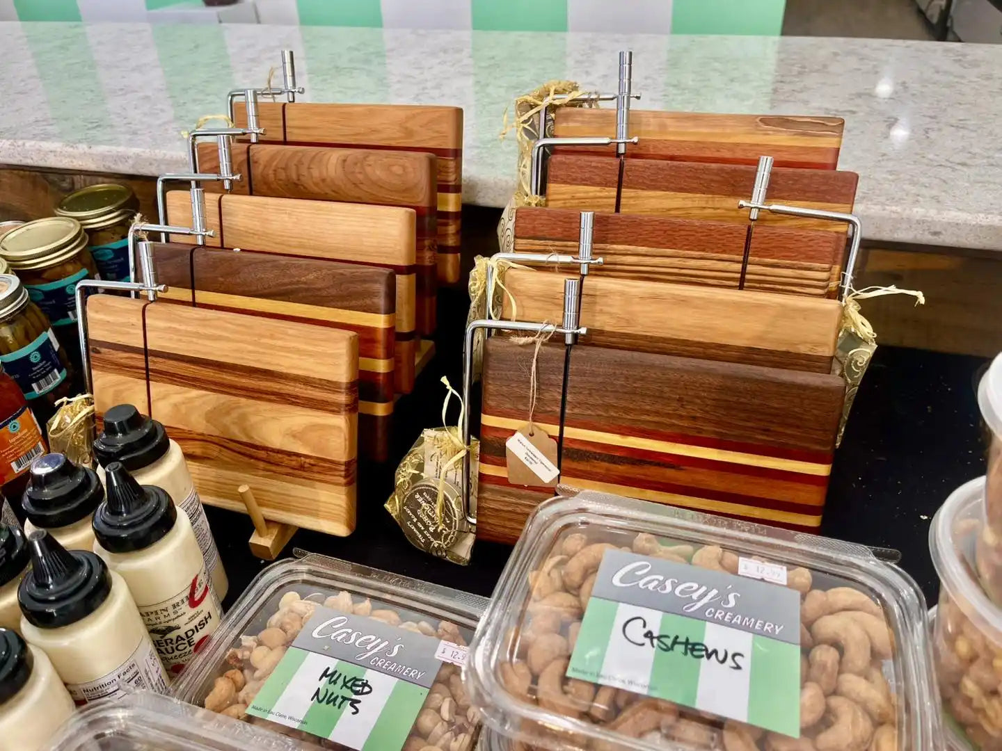 Wooden cheese boards with wire cutters.